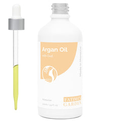 Fatima's Garden Argan and Oud Oil bottle pour for precise application