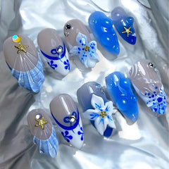 FDSQHSA blue flower press-on nails in almond shape for easy at-home manicure.