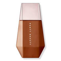 Fenty Beauty Eaze Drop'lit Glow Enhancer bottle in Bronze Jasper for radiant, buildable luminosity.