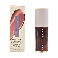 Fenty Beauty Treatz lip oil Black Cherry bottle close-up showing hydration