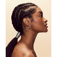 Fenty Hair edge-control gel thickening formula adds fullness to fragile edges.