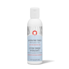 First Aid Beauty hydrating toner bottle close-up, showing a gentle, alcohol-free formula.