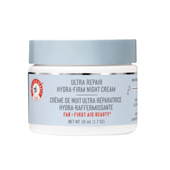 First Aid Beauty Ultra Repair Hydra-Firm Night Cream jar close-up shows rich hydration for nightly repair.