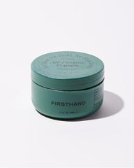 Firsthand pomade texture scoop highlighting smooth, easy-apply formula.