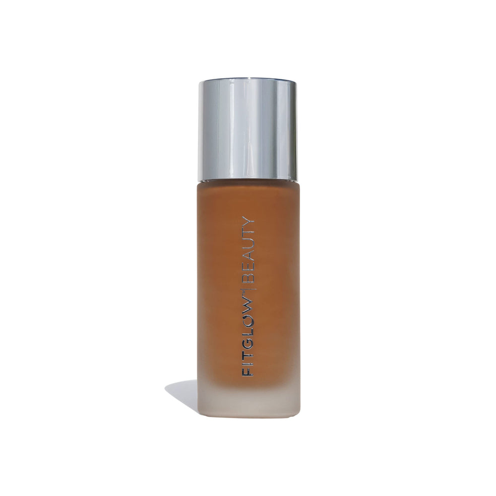 Fitglow Beauty Foundation+ bottle close-up shows vegan packaging for a natural finish