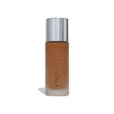 Fitglow Beauty Foundation+ bottle close-up shows vegan packaging for a natural finish