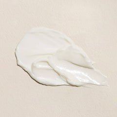 Close-up of Fleur & Bee ingredients featuring caffeine and peptides for brightening.