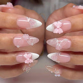Foccna pink almond nails with 3D flowers for a salon-style manicure at home.