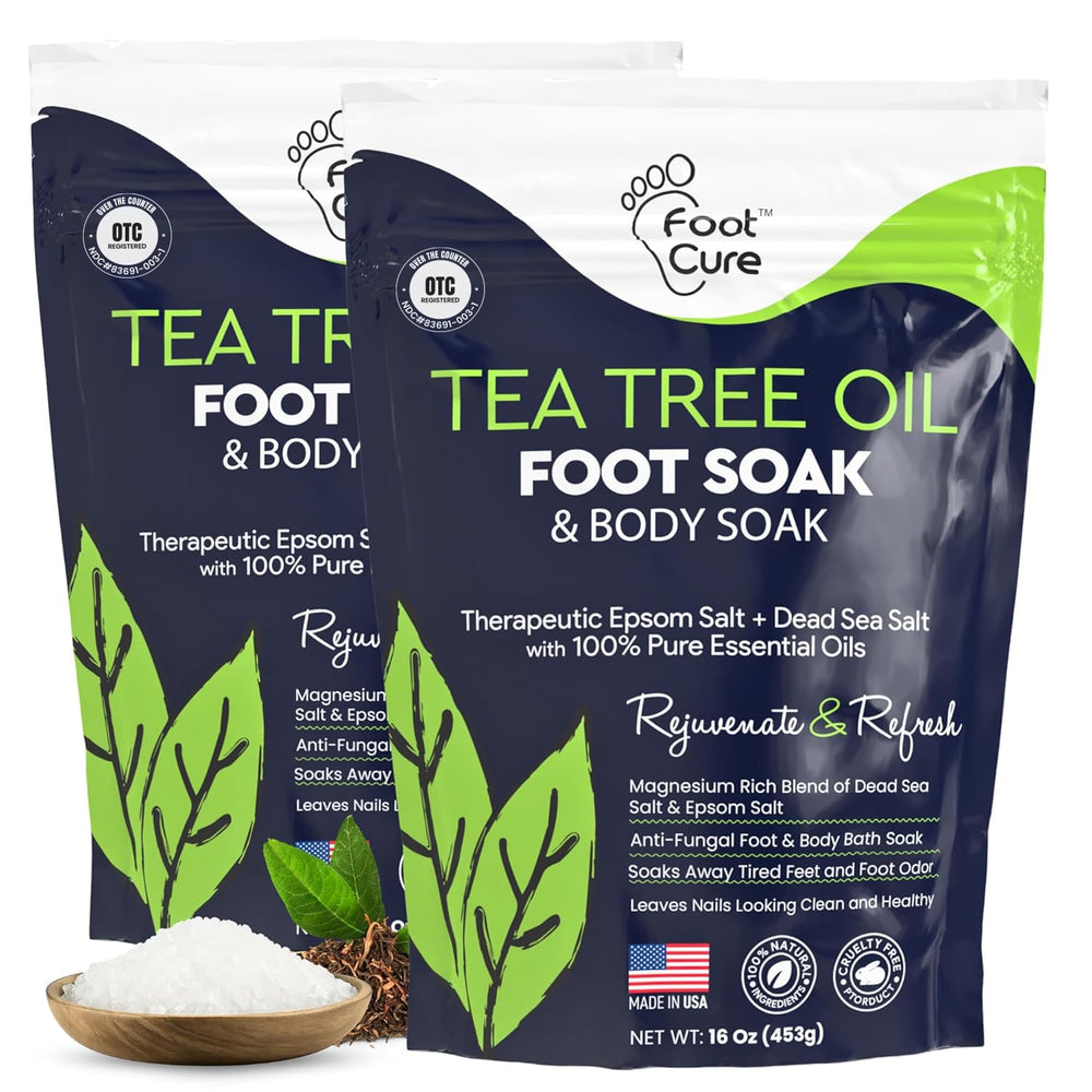 FOOT CURE Tea Tree Oil foot soak bottles ready for at-home spa pedicure.