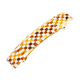 France Luxe checkered barrette close-up showing strong grip for fine hair.