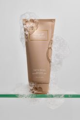 FRIDAYS Her Business Body Wash bottle being poured, releasing a mood-lifting fragrance.