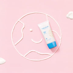 FRUDIA Welcos Sun Block Day Cream Essence on hand demonstrates quick, even blending for natural look.
