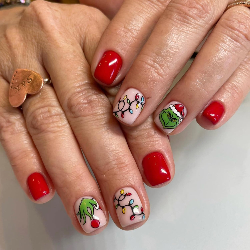 FUKIDOG Christmas nails with green monster design for a playful holiday look.