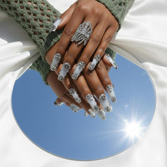FURNUNUBI denim blue nails with metallic charms for party-ready style.