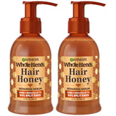 Garnier Whole Blends Honey Treasures Serum bottle showing honey-like repair for damaged, silky hair