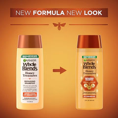 Garnier Whole Blends Honey Treasures shampoo foam close-up showing creamy lather.