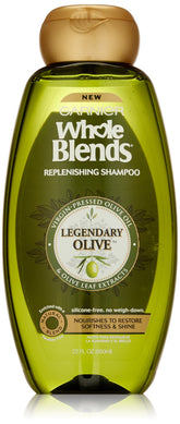 Garnier Whole Blends Legendary Olive shampoo bottle highlights a nourishing formula for dry hair.