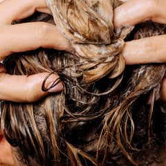 Geologie Strengthening Shampoo on hair reveals smoother, more manageable strands.