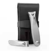 Germanikure nail clippers set in black leather case for travel grooming.