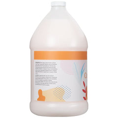 Ginger Lily Farms Coco Mango Conditioner being poured for easy application.