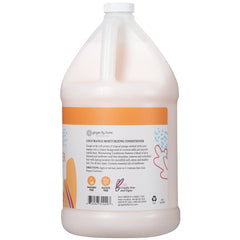 Ginger Lily Farms Moisturizing Conditioner applying to hair for silky shine.