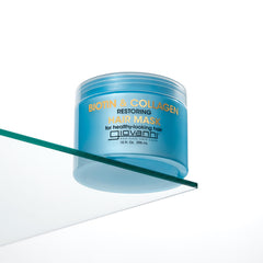 GIOVANNI Biotin & Collagen Hair Mask on hair strands suggests improved moisture and bounce.