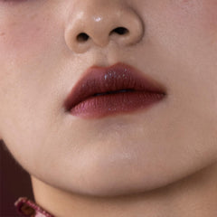 GIRLCULT Matte Lip Stain lip swatch displaying bold color and sparkle depth