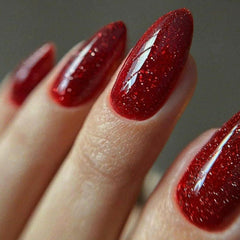 GLAMERMAID golden red press-on nails in medium almond with jelly shine.