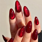 GLAMERMAID red magnet cat eyes nails in short almond for a bold, salon-like finish.