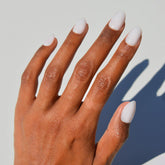Glamnetic Clean Girl milky nails in a short oval shape for a sleek salon look.