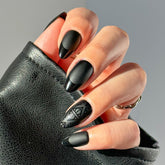 Glamnetic Deathly Hallows nails with matte base and glossy tips for dramatic, long-lasting style.