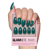 Glamnetic emerald green press-on nails in short almond shape with a glossy finish for a salon vibe
