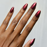 Glamnetic Gryffindor chrome graphic nails closeup with scarlet shine for bold everyday style