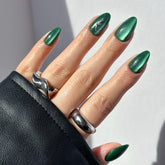 Glamnetic Slytherin emerald green snake graphic nails with velvet finish for a bold look.