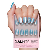 Glamnetic Subzero nails with icy blue snowflake graphics for a chic winter look that lasts.