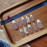 Gleamrain almond nails with a soft pastel base for everyday elegance and easy pairing.