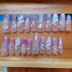 Gleamrain nails feature rhinestones and charms for chic embellishments.