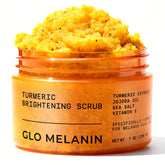 Glo Melanin Turmeric Scrub bottle pours, suggesting a smooth glow and gentle exfoliation.