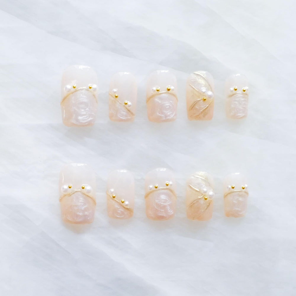 GLORS luxury pearl press-on nails in ballerina medium shape for a sophisticated at-home manicure.