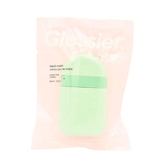 Glossier Hand Cream Sandstone pod close-up highlighting quick absorption and soothing hydration.