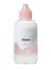 Glossier Milky Oil dual-phase bottle pour shows makeup melting action for easy removal.