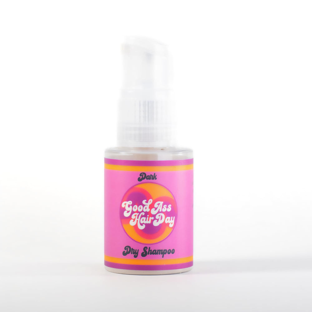 Good A- Hair Day Dry Shampoo Powder in dark packaging refreshes oil-prone roots.