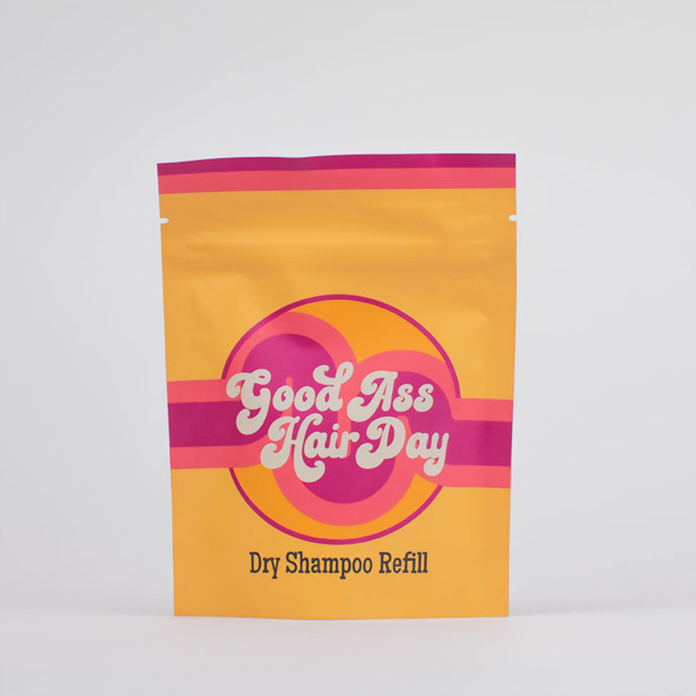 Good Ass Hair Day dry shampoo refill vanilla packaging highlights eco-friendly, travel-ready design.