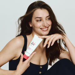 Powerscrub bottle shows Vitamin E droplets for nourishing scalp care