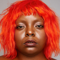 Riot color swatch displaying neon orange payoff and conditioning base