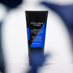 Applying the mask to damp hair demonstrates easy distribution and smooth styling.