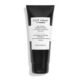 Hair Rituel by Sisley fortifying shampoo bottle demonstrates premium cleansing for fuller-looking hair