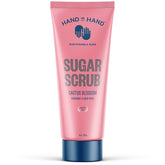 Hand in Hand Sugar Scrub bottle pour demonstrates easy application and gentle exfoliation.
