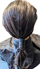 Hair wrap worn in a ponytail to show styling and versatility