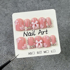 Short square nails with bow embellishment for chic everyday wear.